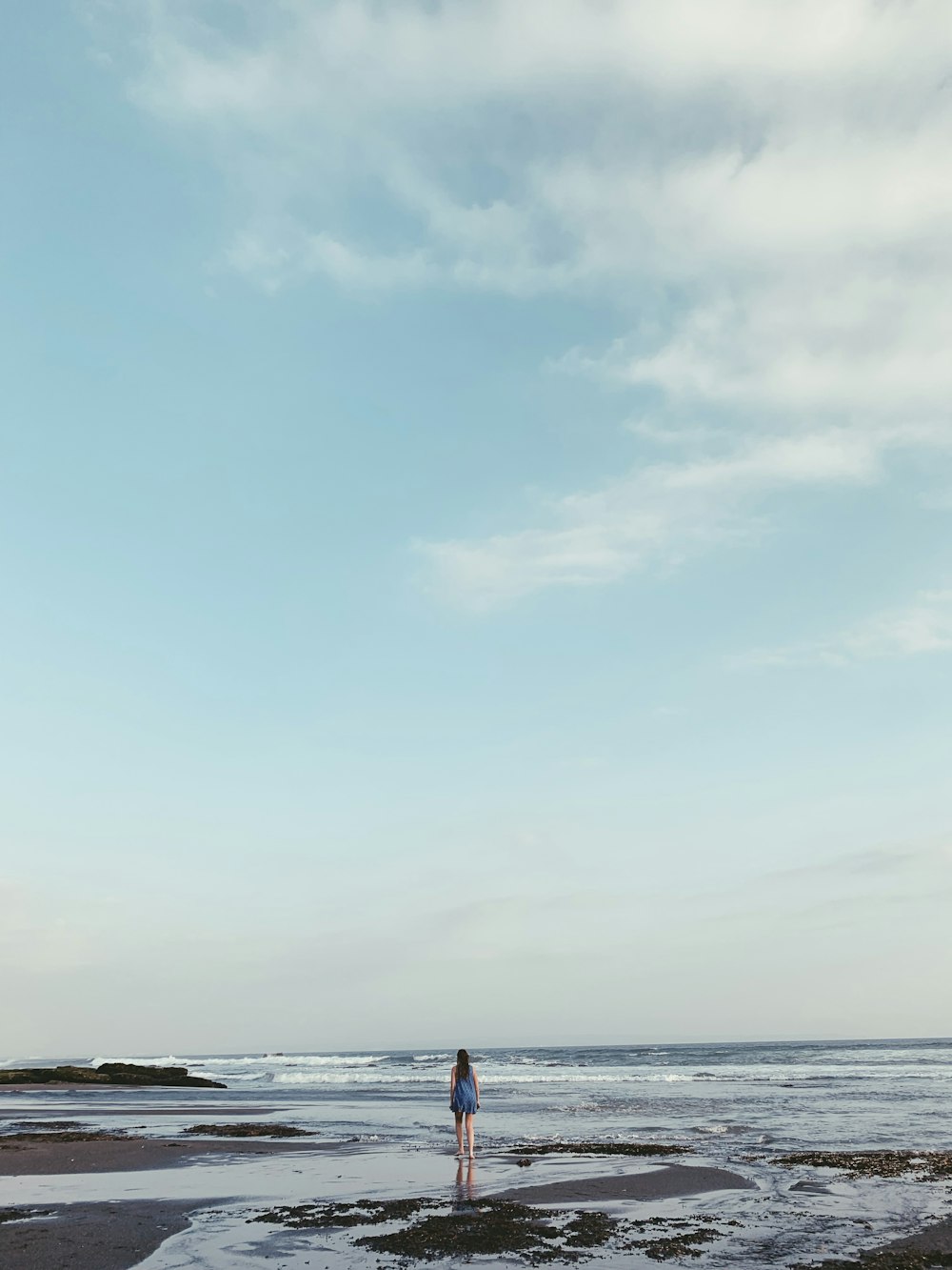 landscape photo of a woman on a beach