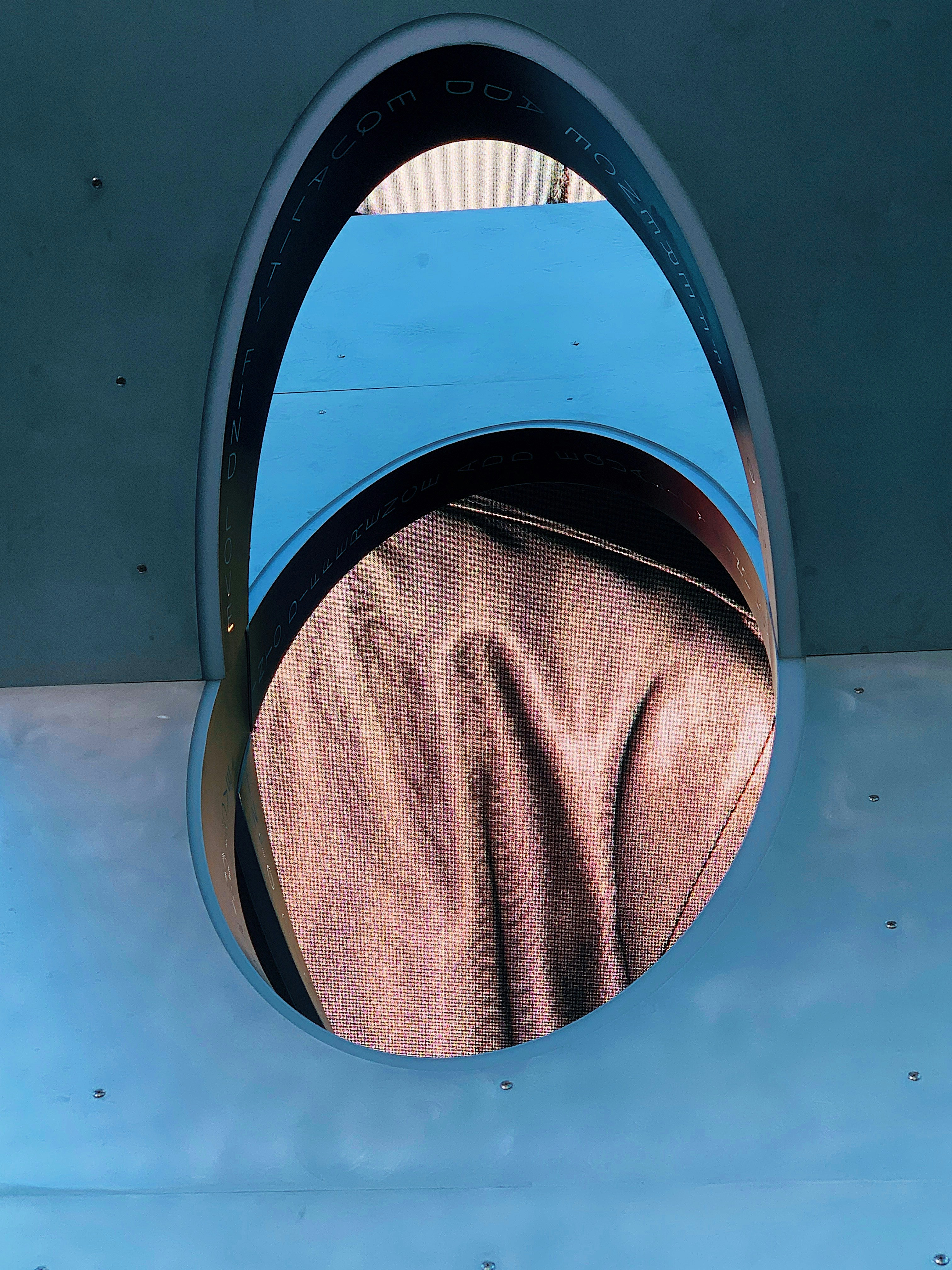 a reflection of a woman's face in a mirror