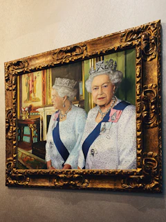 Softly lit portrait of the two sisters founders wearing signature pieces, smiling warmly.