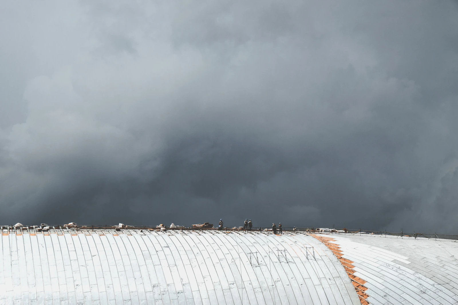 Storm clouds gathering over a rooftop in the Dallas, TX area