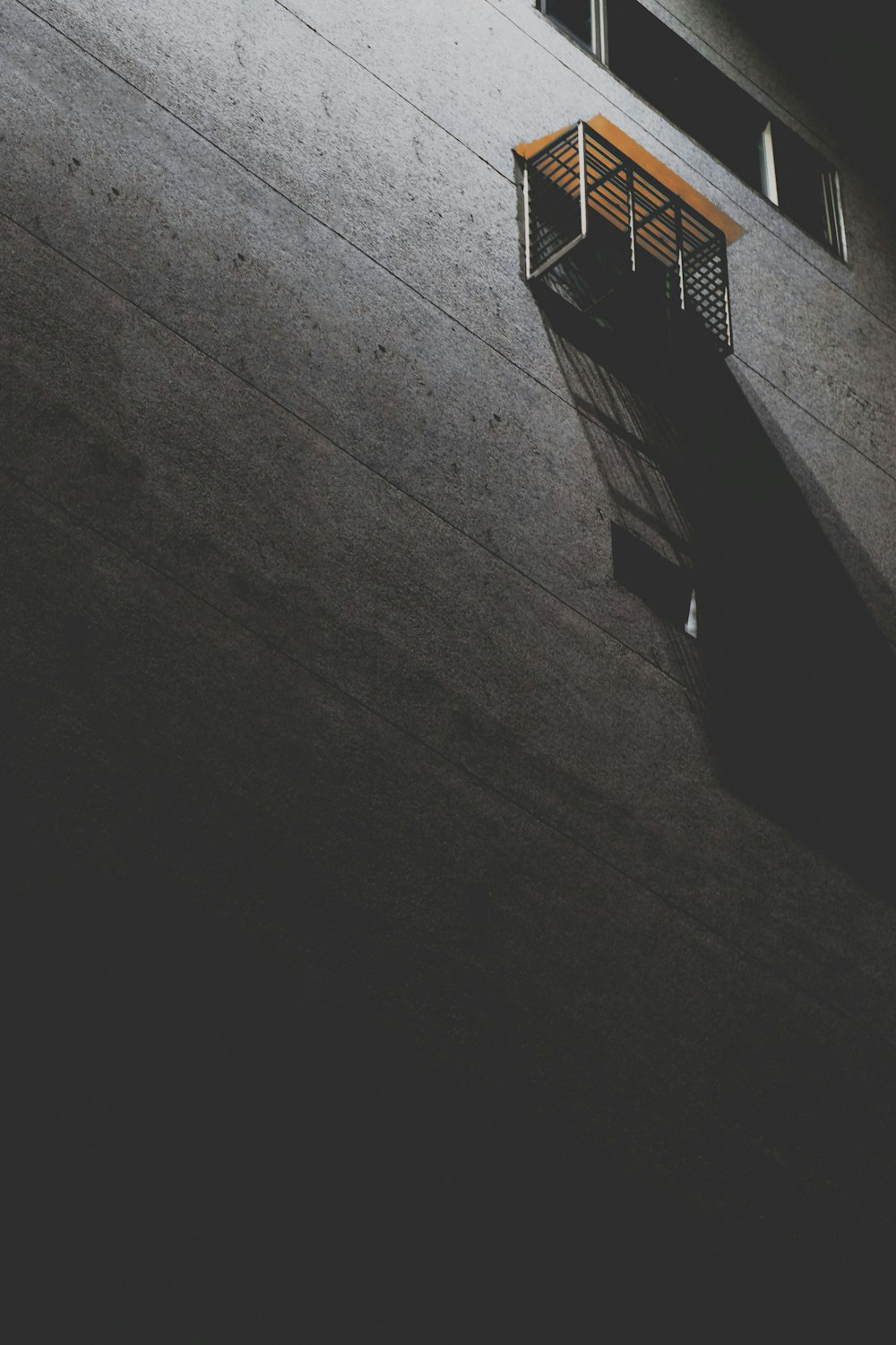 a small balcony on the side of a building