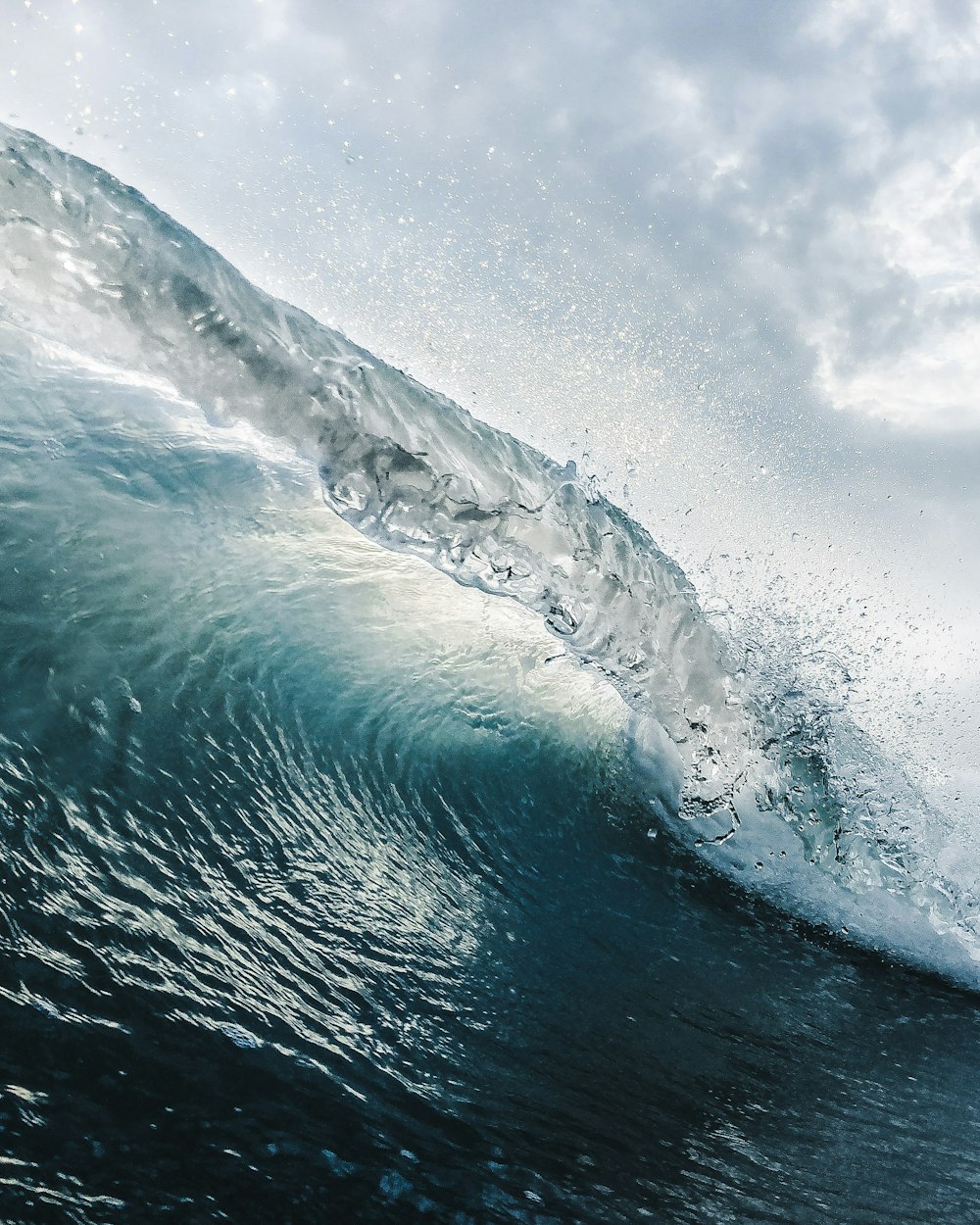 a large wave in the middle of the ocean