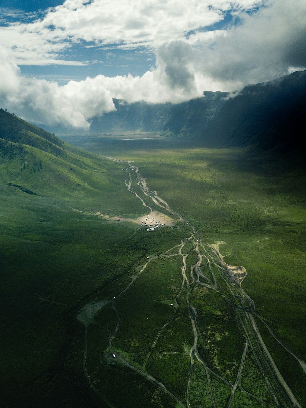 aerial photo of mountain under cloudy sky during daytime