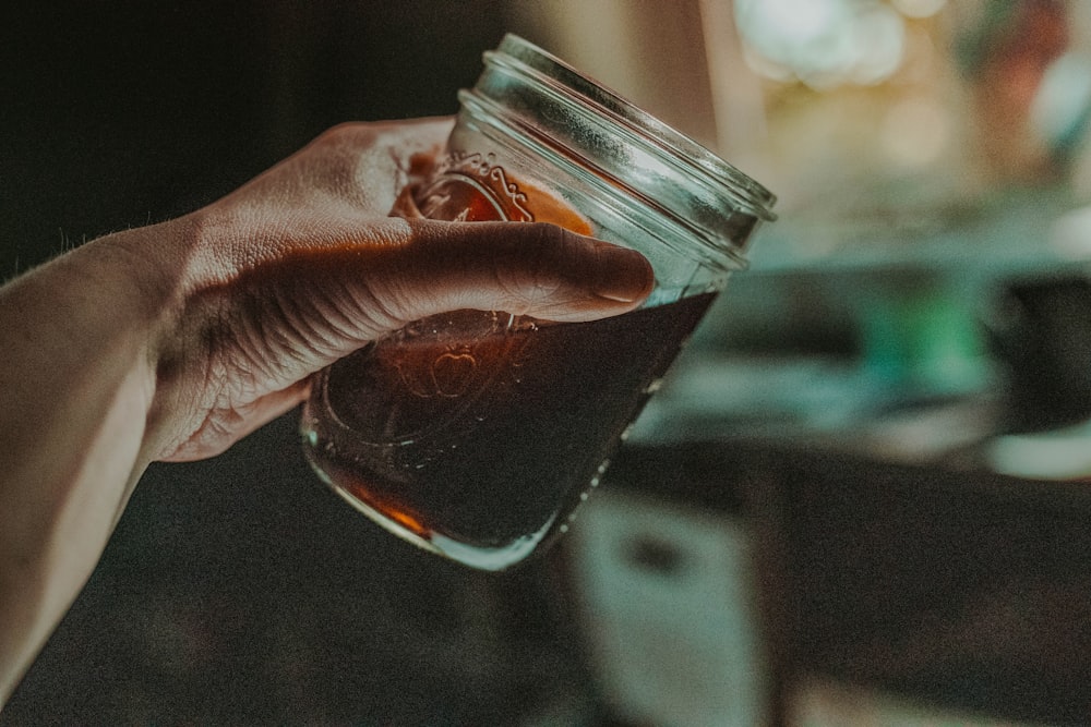 selective focus photography of glass jar