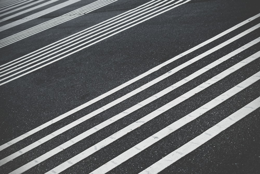 a black and white photo of a crosswalk