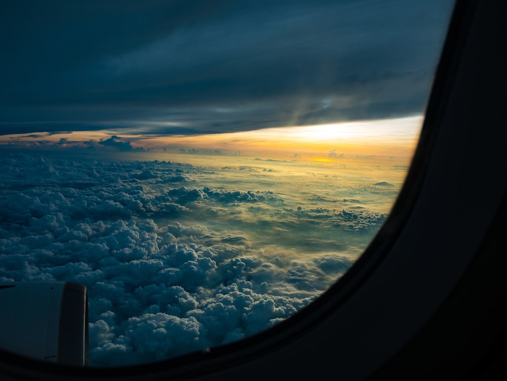 airliner window view of white clouds