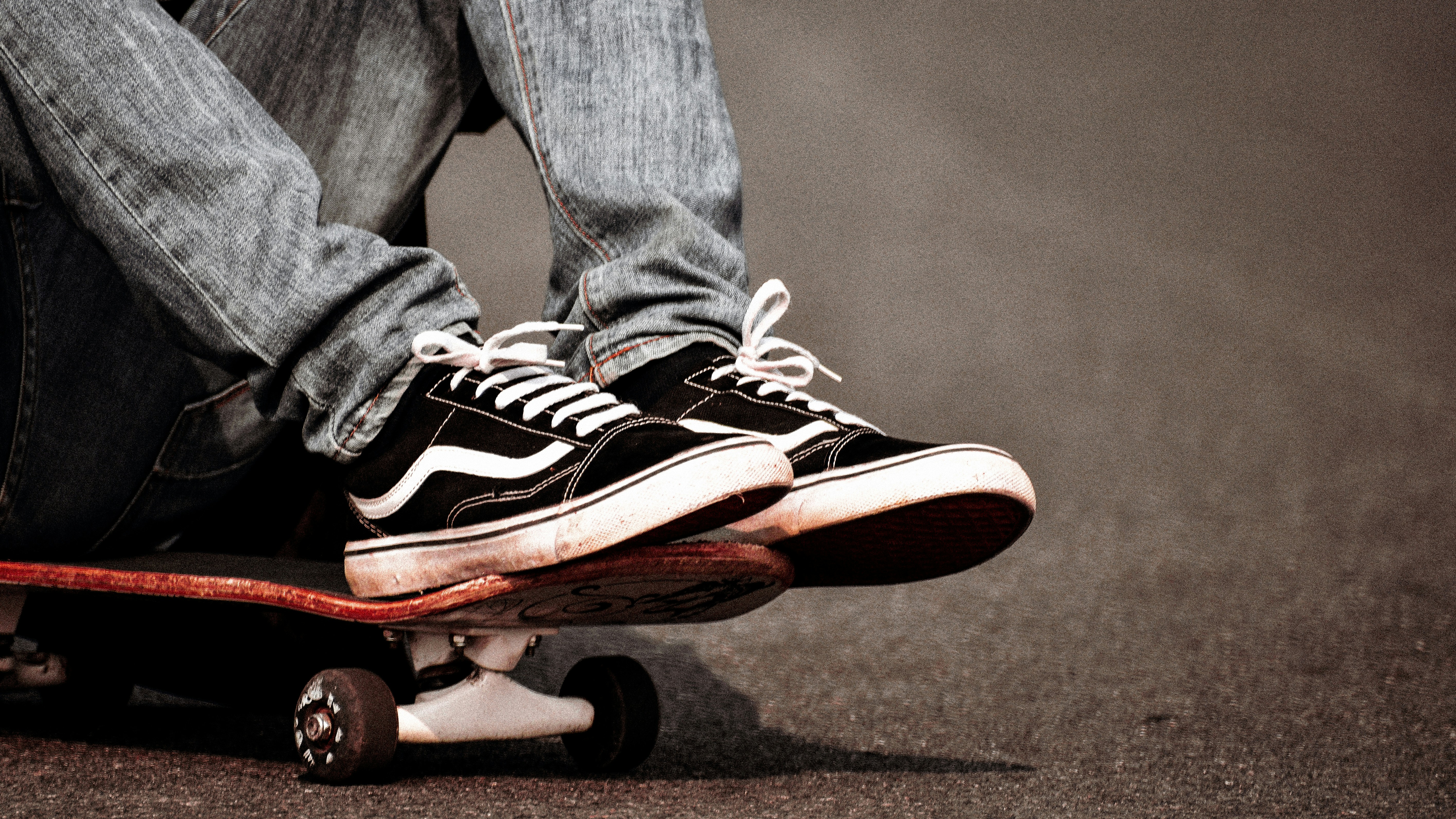 person sitting on skateboard