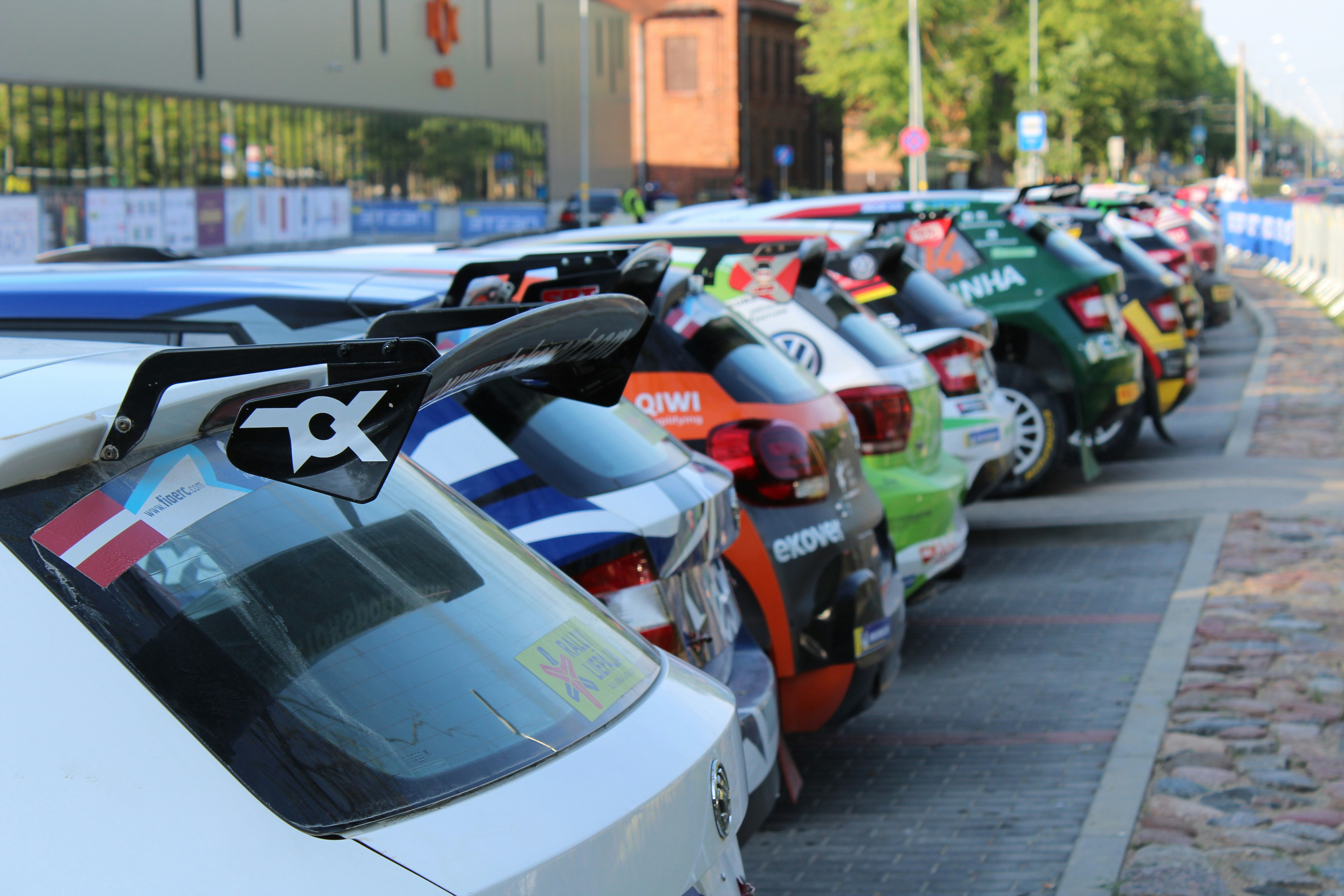 Row of used electric vehicles parked in a dealership lot