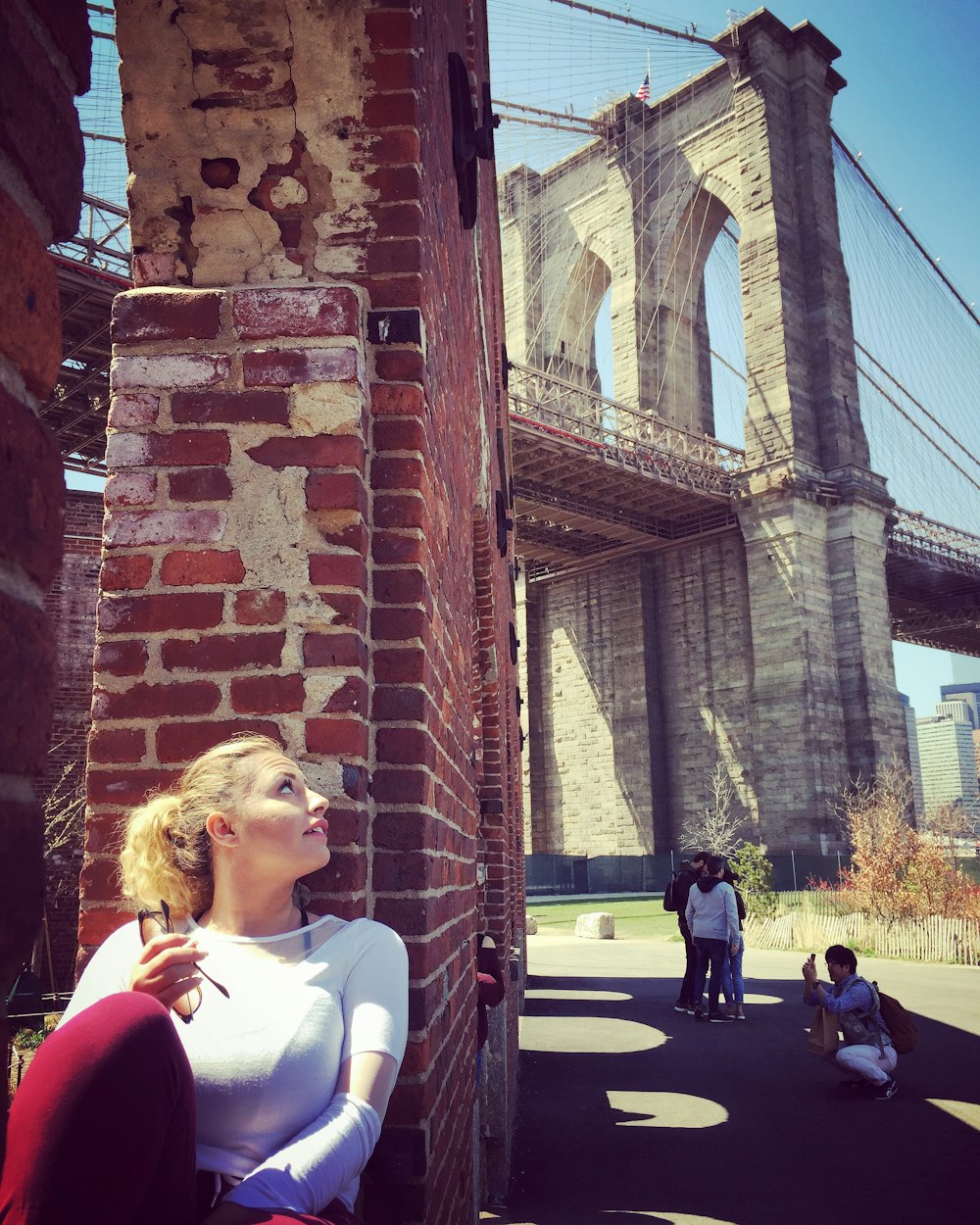 woman leaning on wall facing up