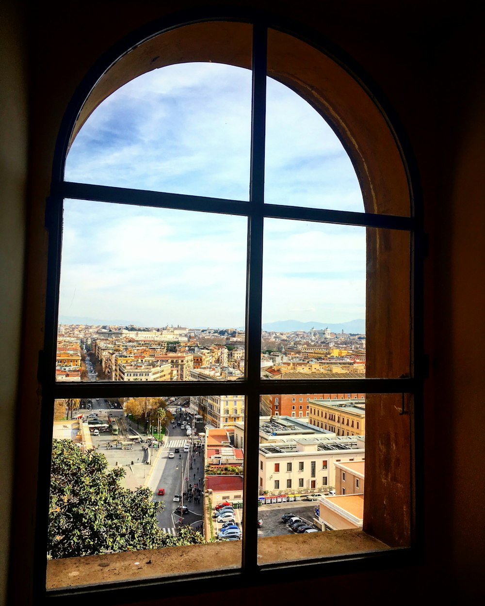 a window with a view of a city