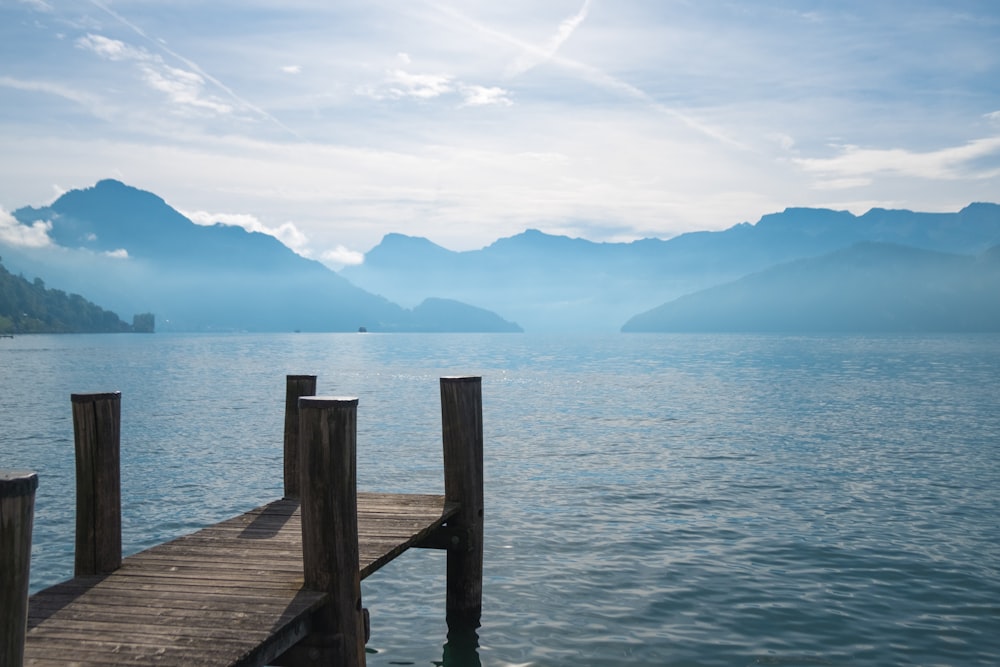 empty wooden dock during foggy weather at daytime