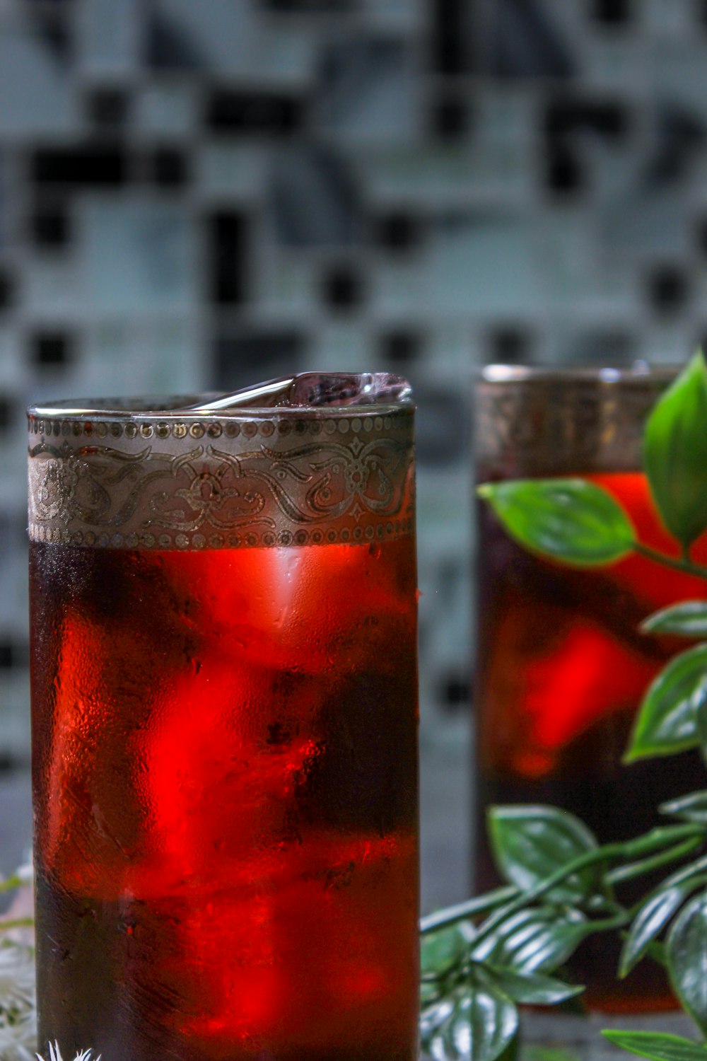 shallow focus photo of red glass bottle