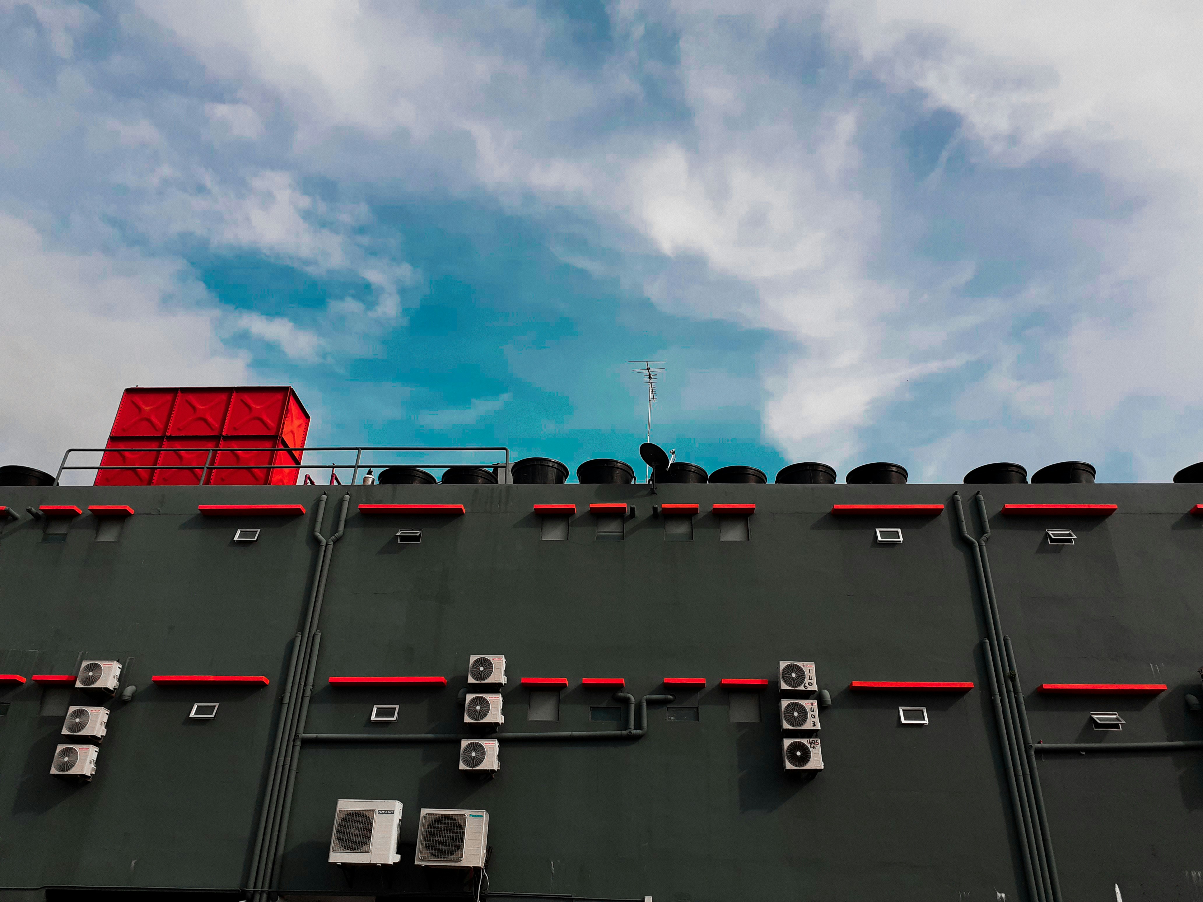 black and red building under blue sky