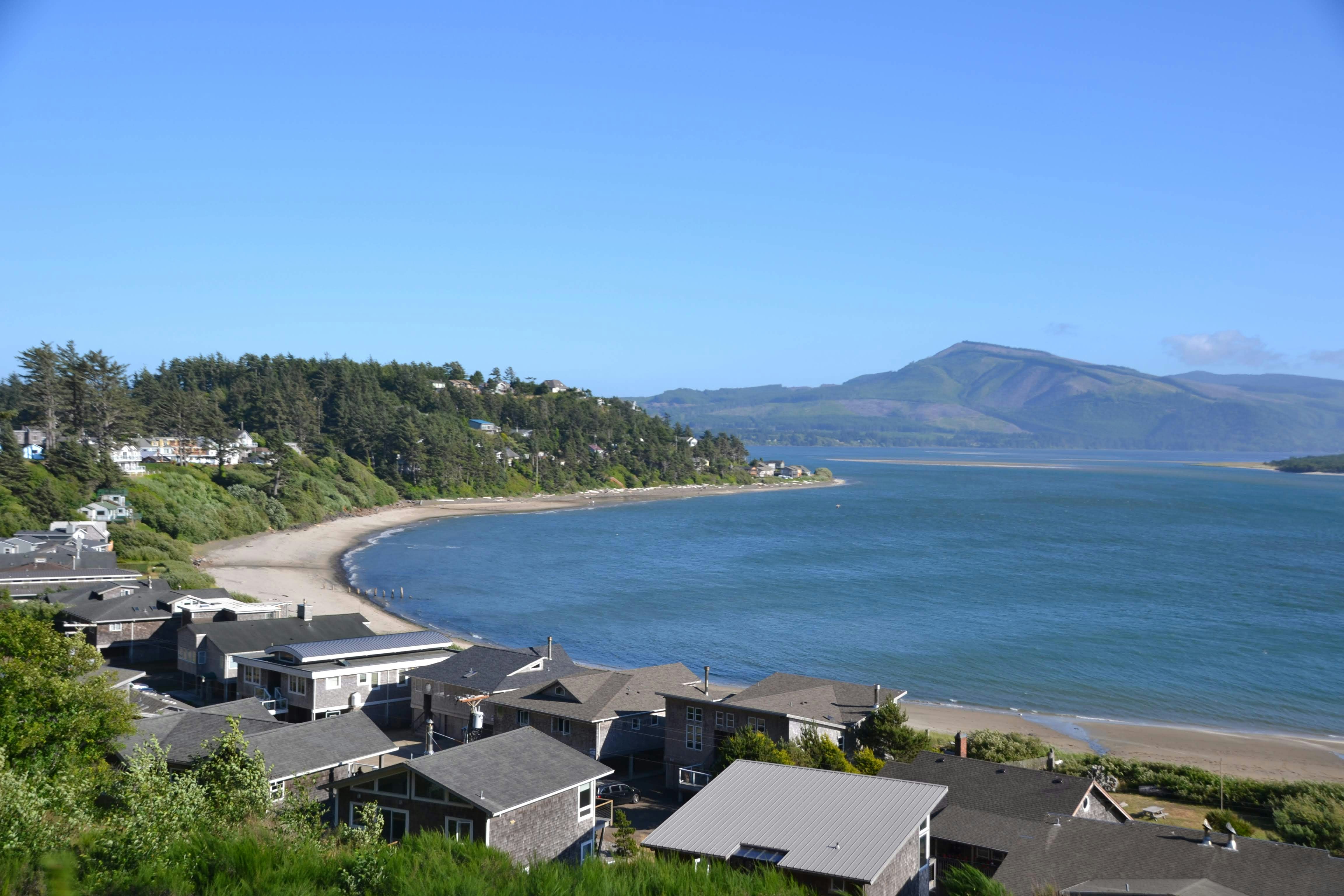 seashore near houses during daytime