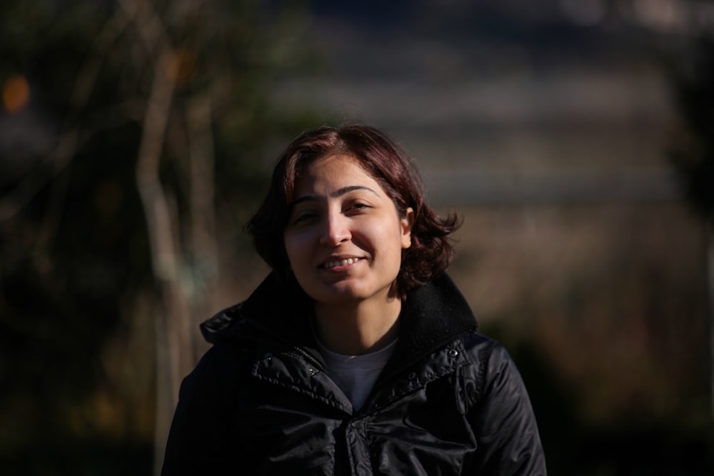 woman standing near woods