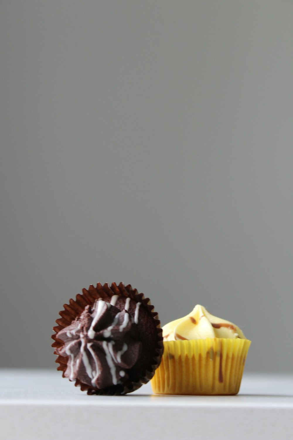 two chocolate and mango cupcakes