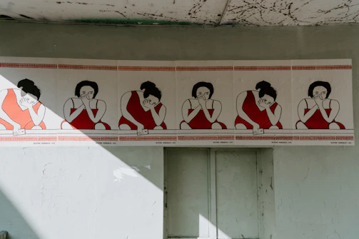 Close-up of a glossy poster with elegant shadows highlighting the dominatrix's silhouette.