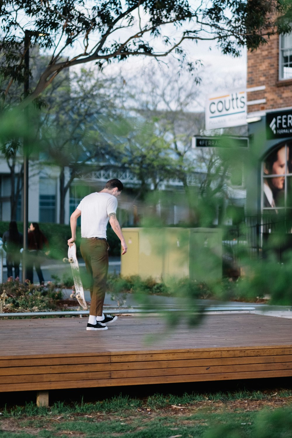 man holding skateboard