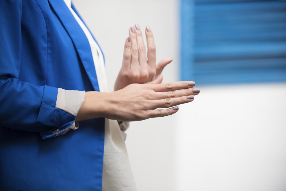 person wearing blue blazer