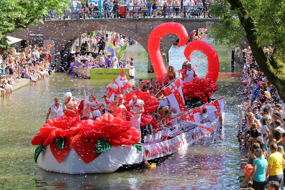 pink floral boat on body of water