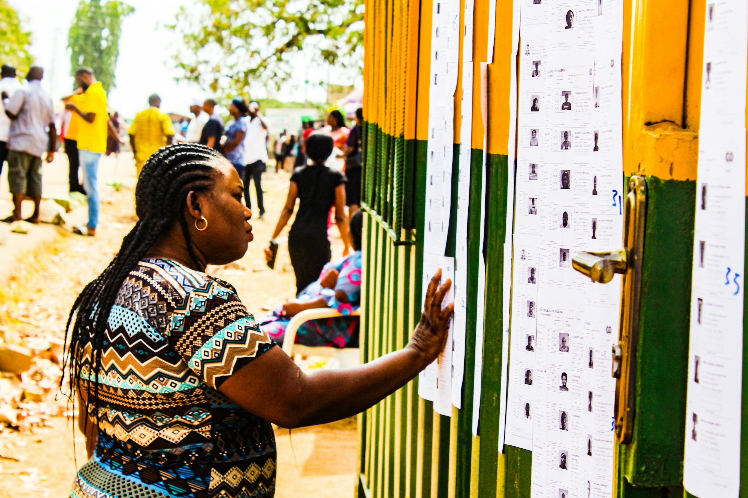 This picture was taken during the Nigerian 2019 General Elections. A voter checks for her name on the voter's list.