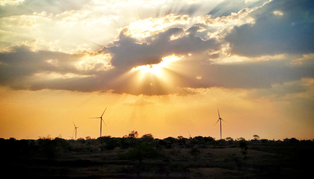 silhouette windmill during sunset