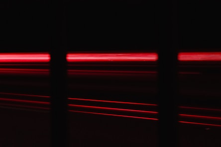 a blurry photo of a red light in the dark