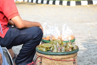 cooked food with banana wrap on brown basket