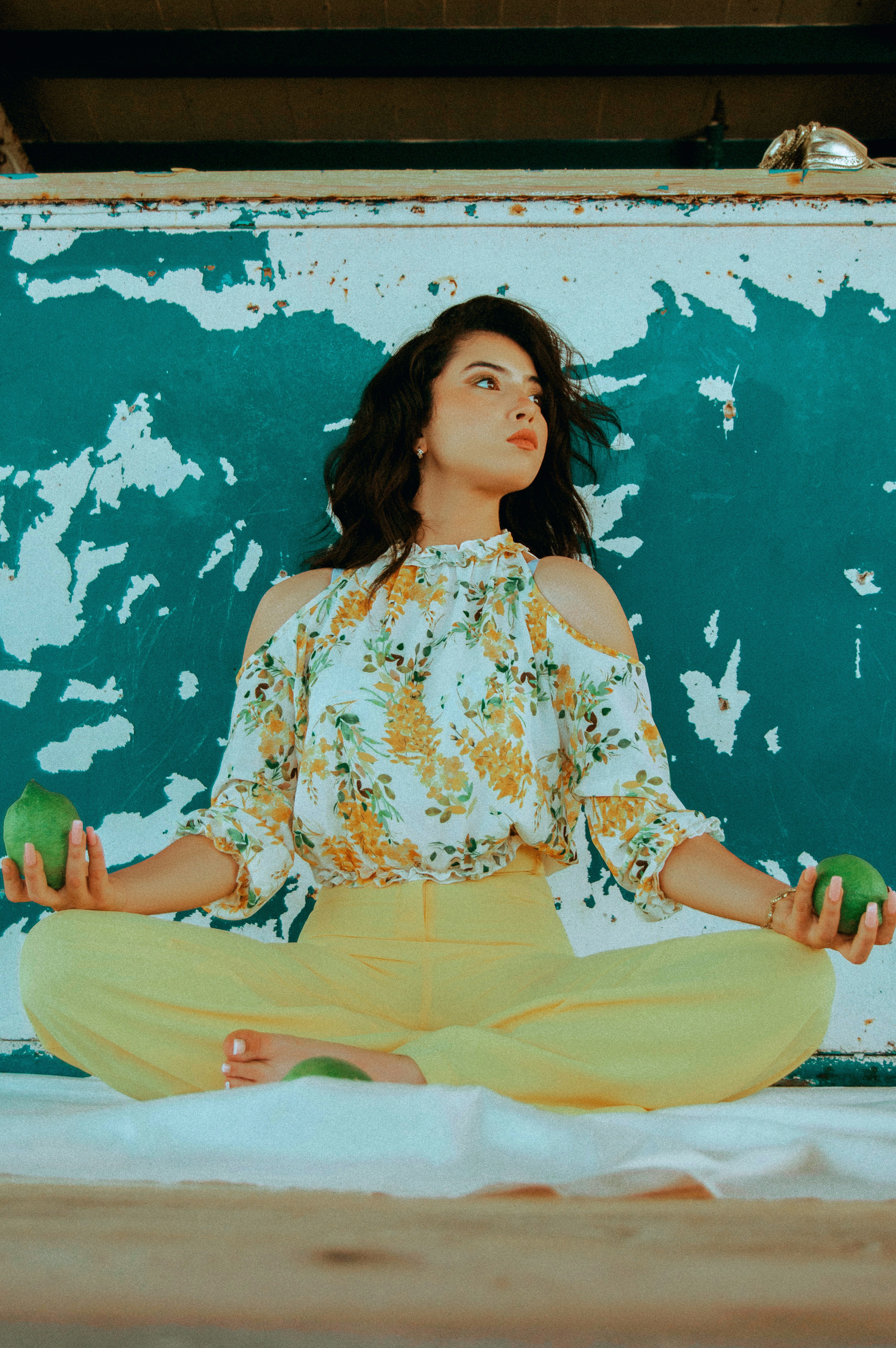 woman wearing white and yellow floral dress