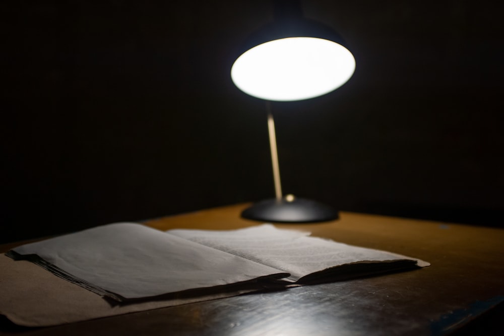 Black table lamp beside book photo – Free Theme Image on Unsplash