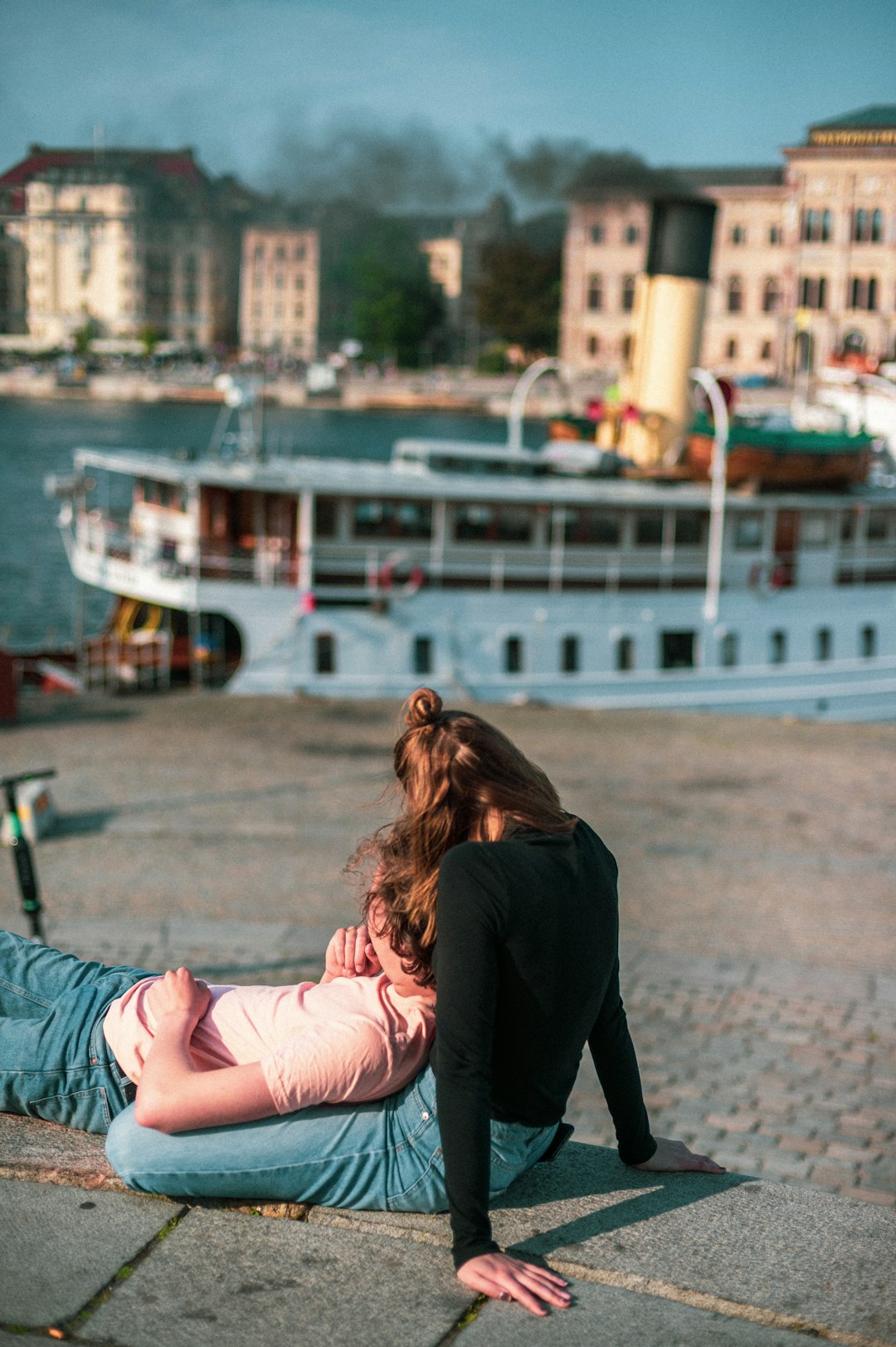 man lying on woman lap