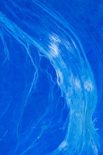 Vivid blue abstract pattern resembling flowing lines or streams. The design has a mix of darker and lighter blue hues, with some white streaks creating a sense of movement.
