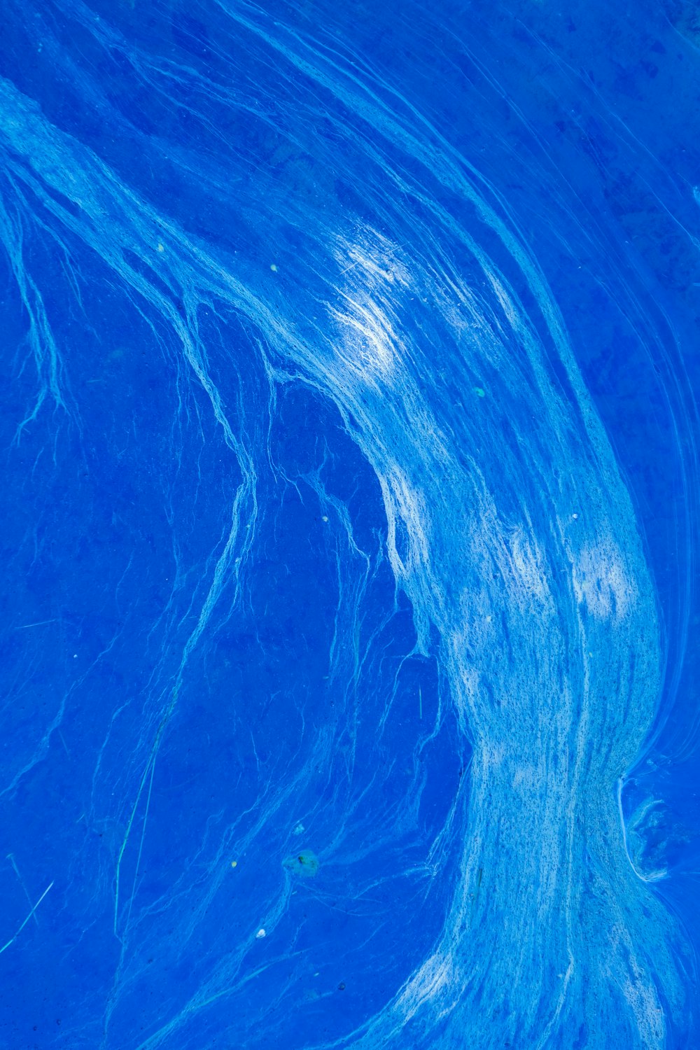 a close up view of a blue water surface