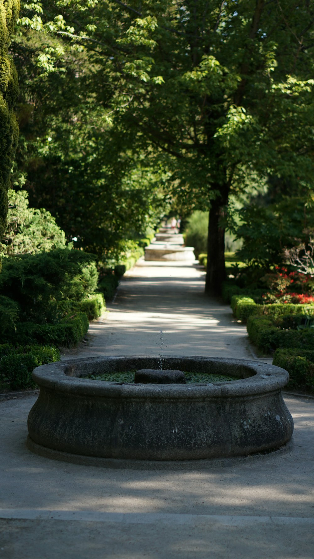 round gray water fountain