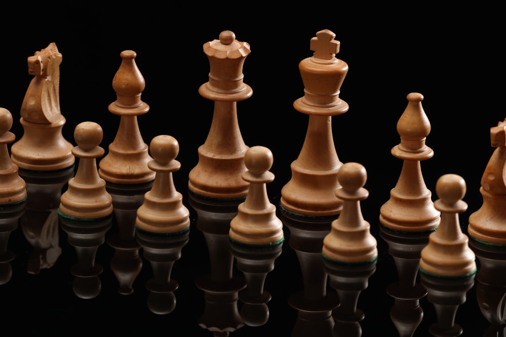 beige wooden chess pieces