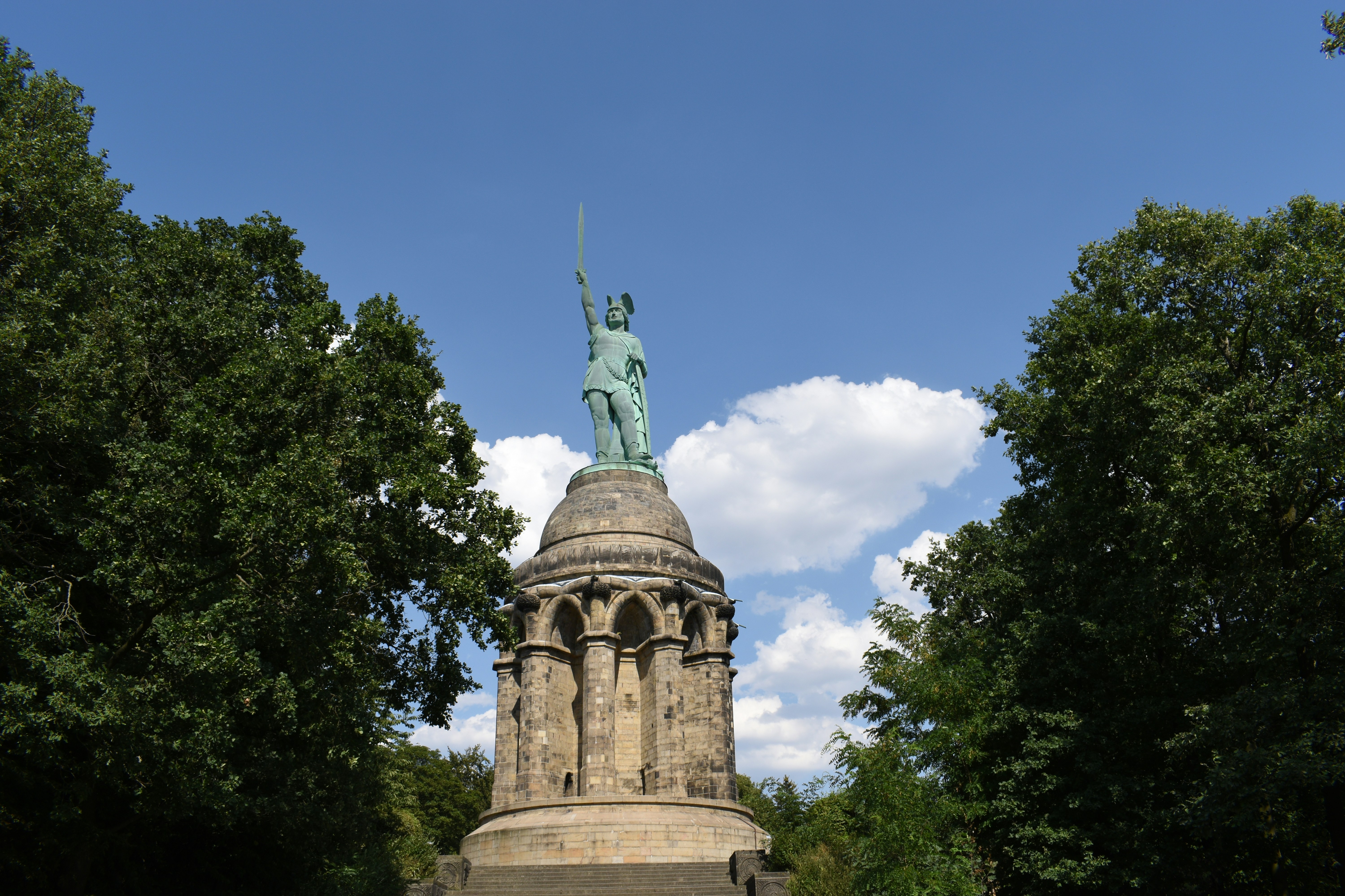 man holding sword statue