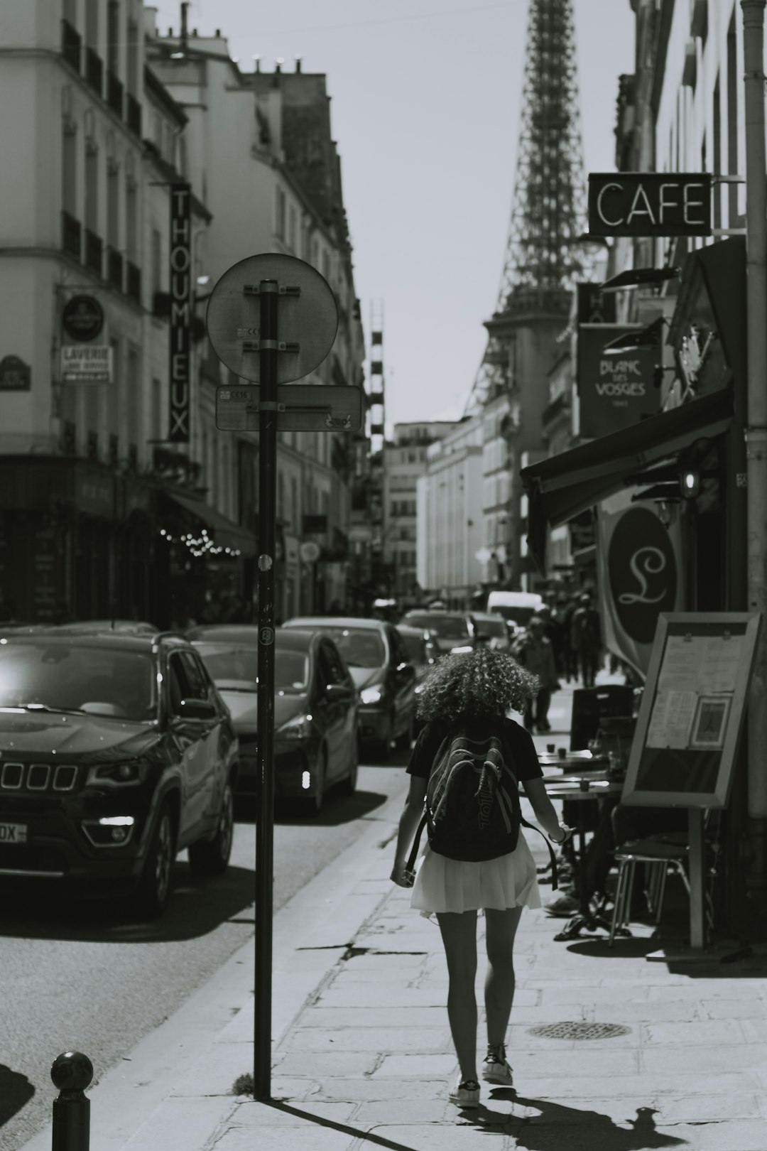 woman walking beside road