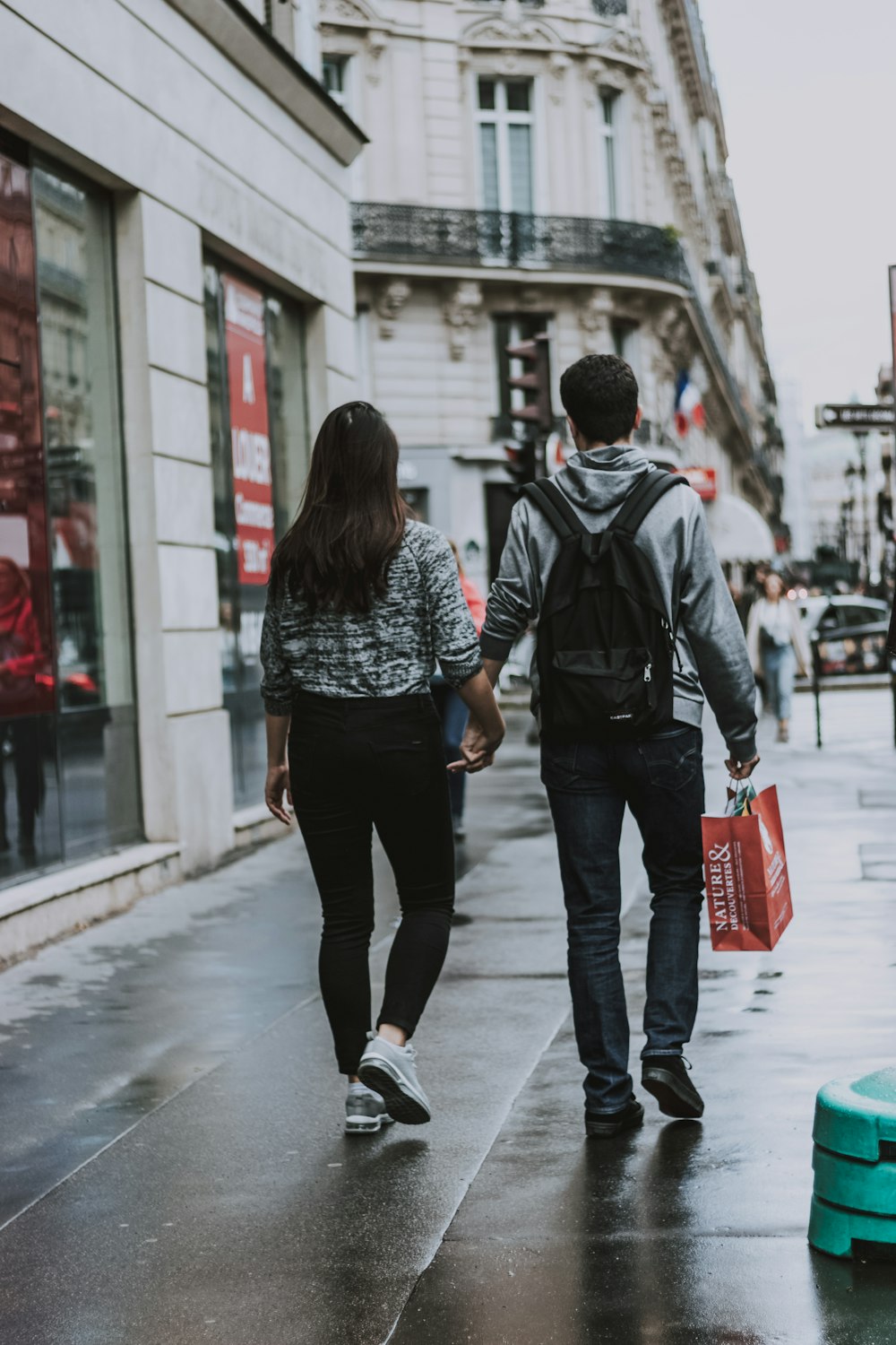 man and woman holding hands