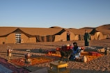 A traditional Berber tent set up in the desert.