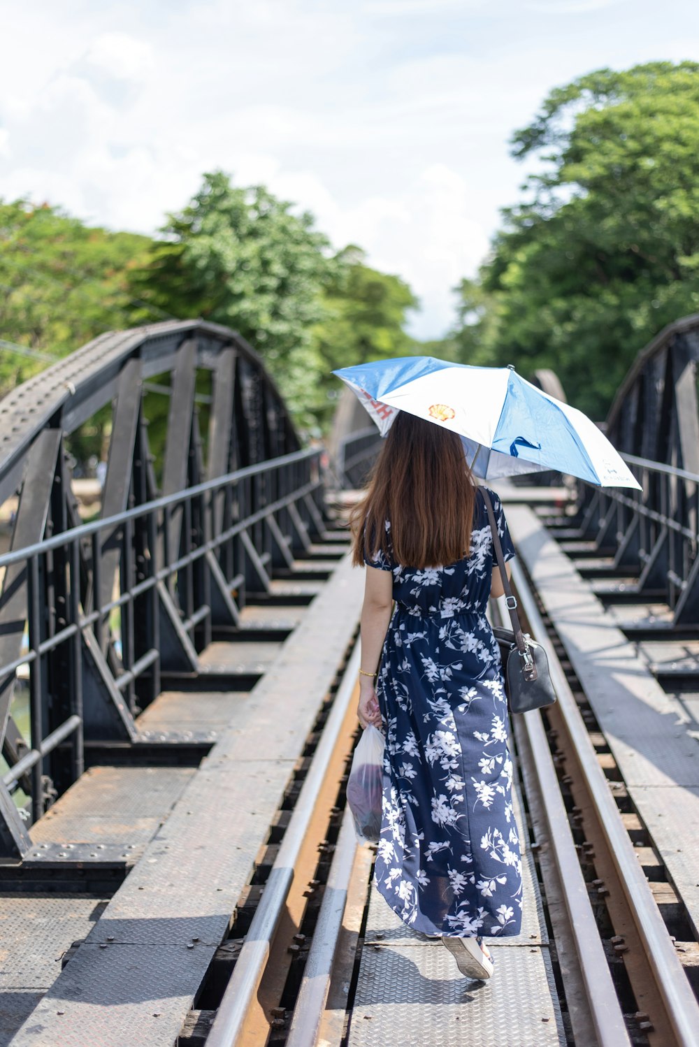 woman walking on bridge