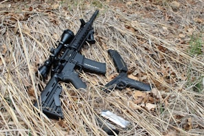 High-capacity magazines for rifles displayed against a rugged outdoor background.
