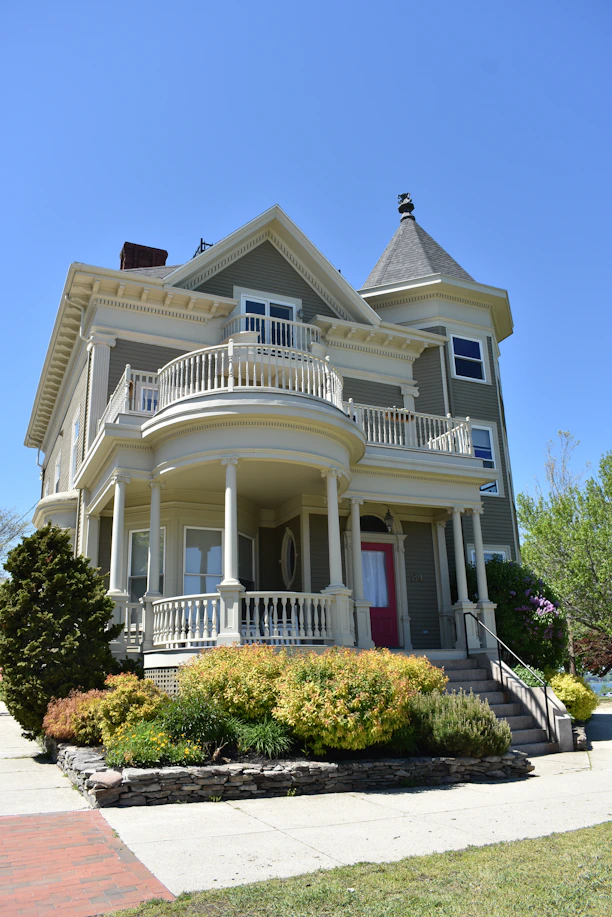 white and gray wooden 2-storey house