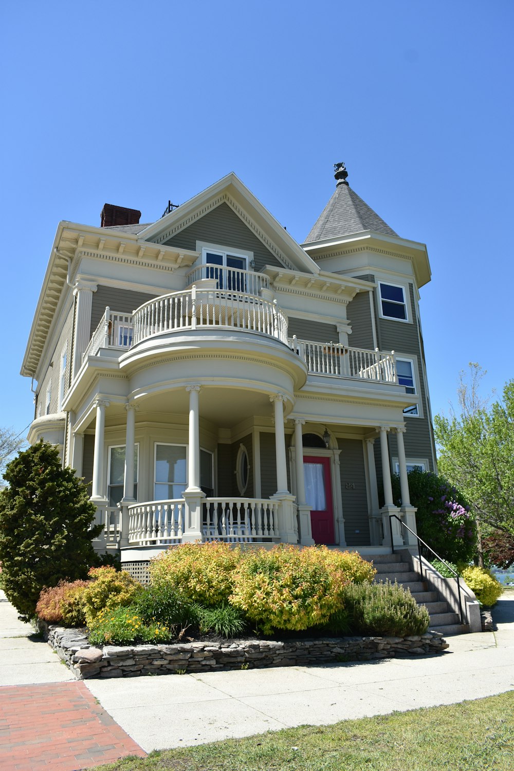 white and gray wooden 2-storey house