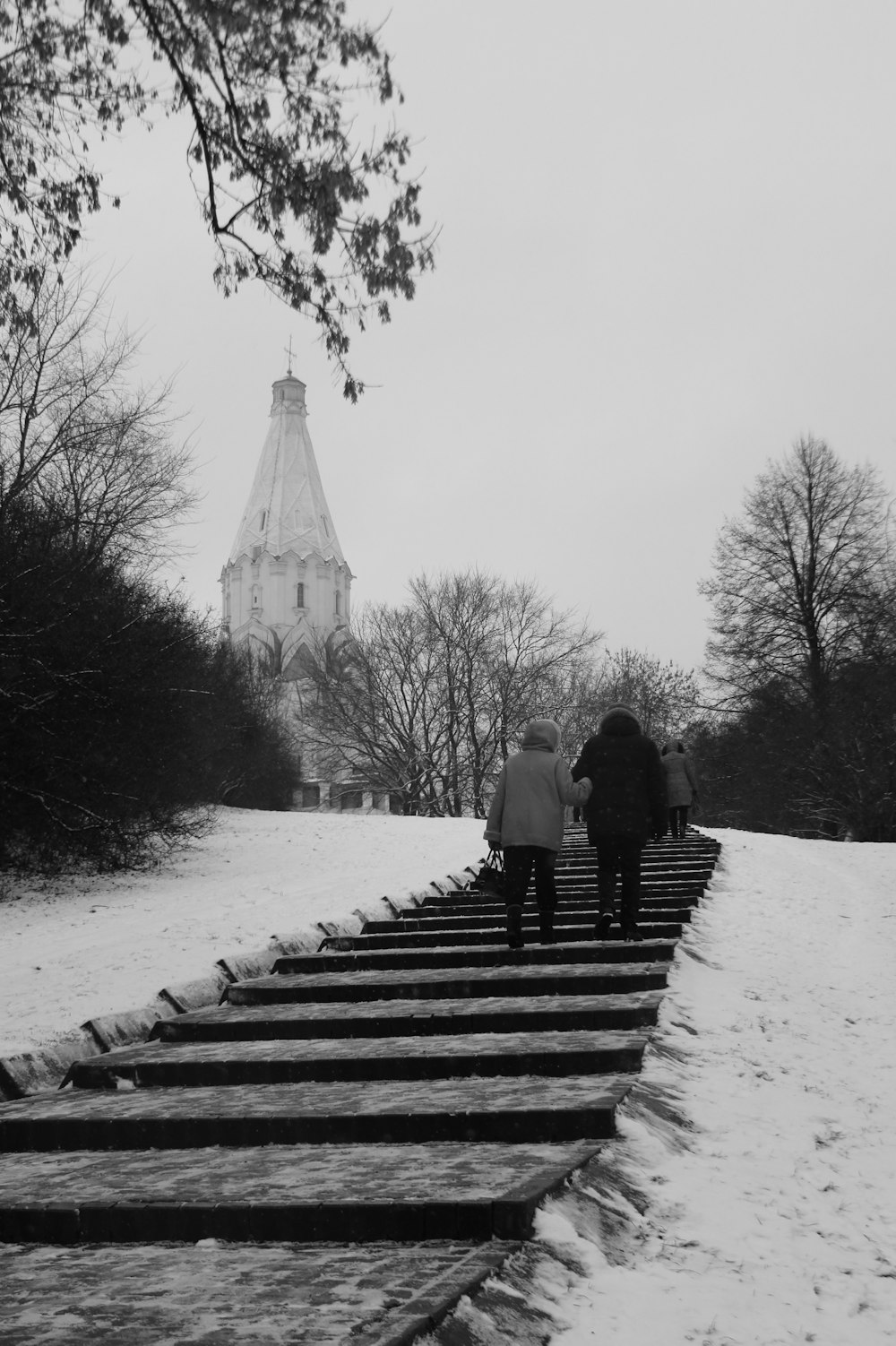 two people walking on stairs