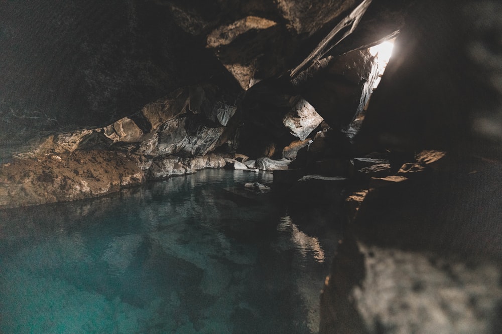 a body of water inside of a cave