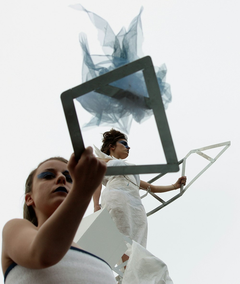 woman in white sleeveless dress