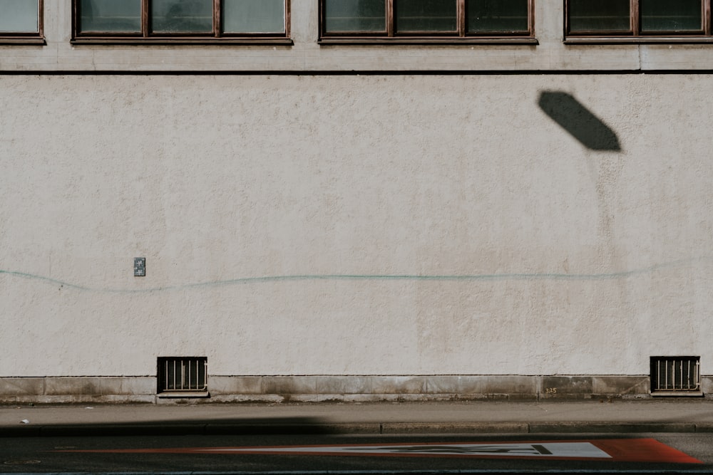 white painted concrete wall during daytime