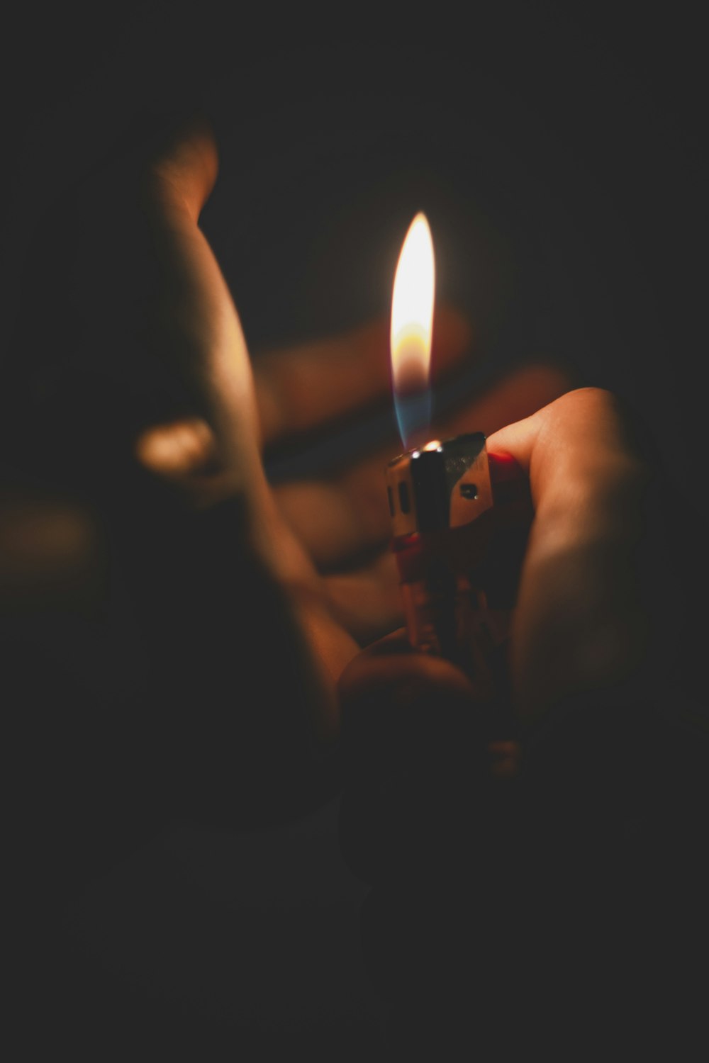 selective-focus photography of burning lighter