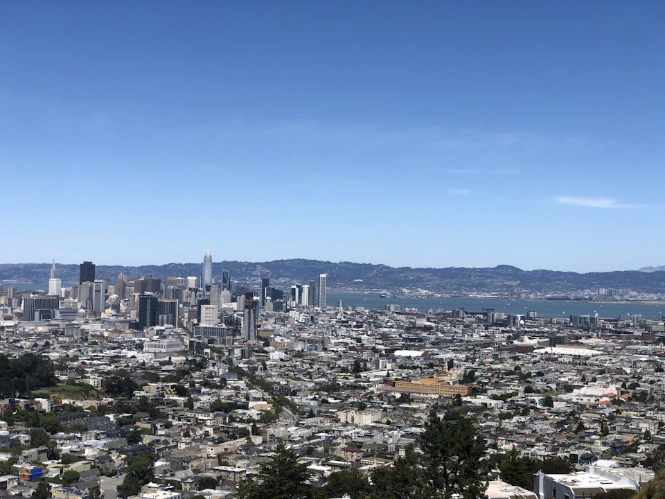 Golden Gate Bridge spans across San Francisco Bay Area with dense cityscape in background