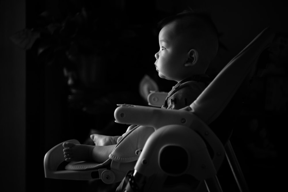 baby seated on bouncer seat